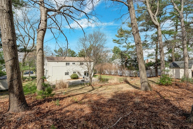 101 Grissom Way, Hauppauge, NY 11788 - view of yard featuring an outdoor structure and fence