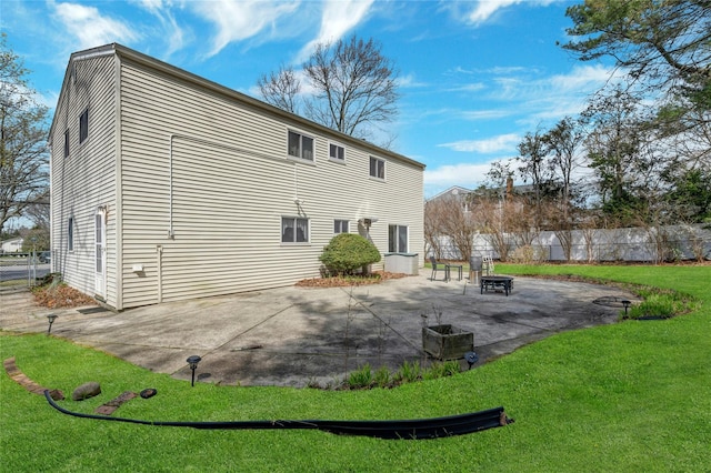 101 Grissom Way, Hauppauge, NY 11788 - back of house featuring a patio area, fence, a fire pit, and a lawn