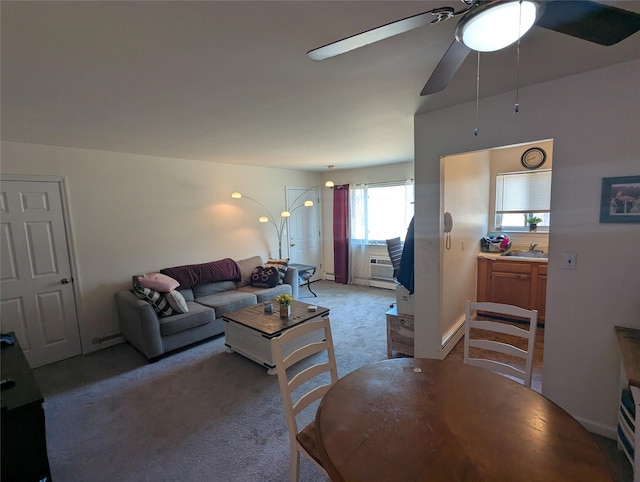 living room with light colored carpet and ceiling fan