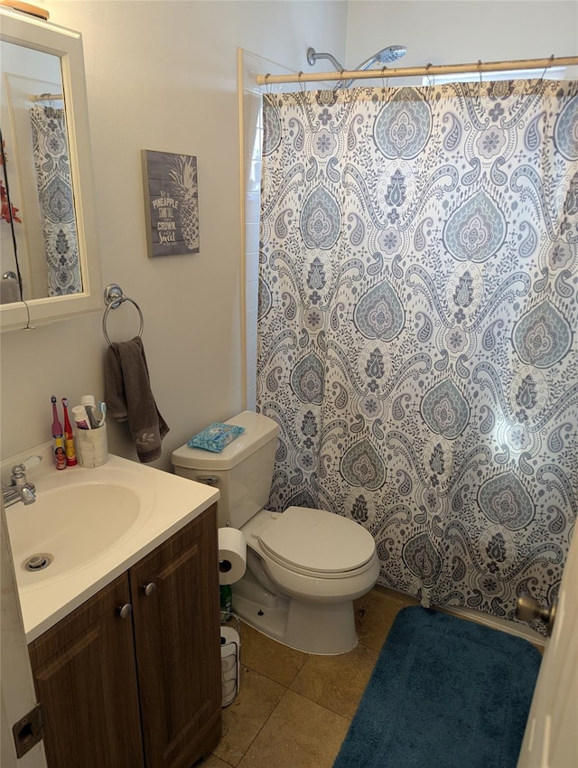 full bathroom featuring tile patterned flooring, a shower with curtain, toilet, and vanity