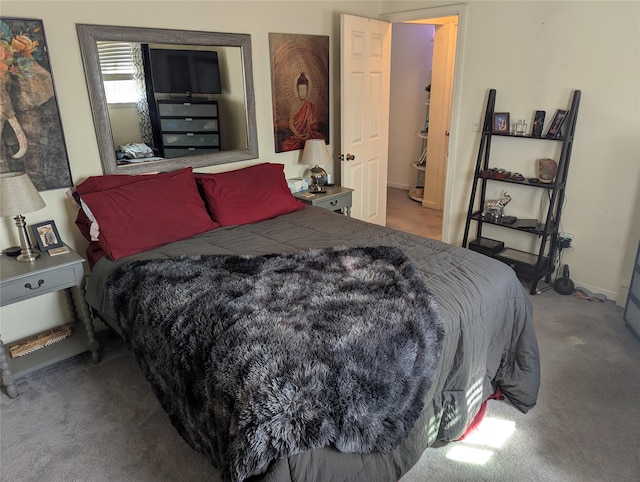 bedroom with baseboards and carpet floors