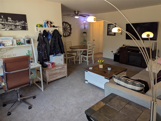 carpeted living room featuring arched walkways and ceiling fan