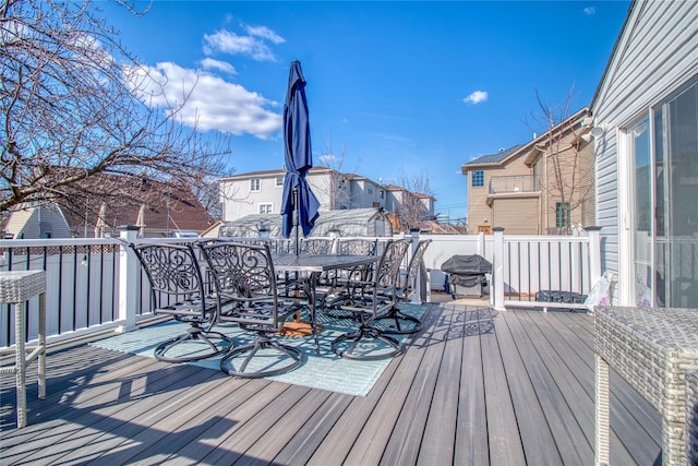 wooden terrace featuring outdoor dining space