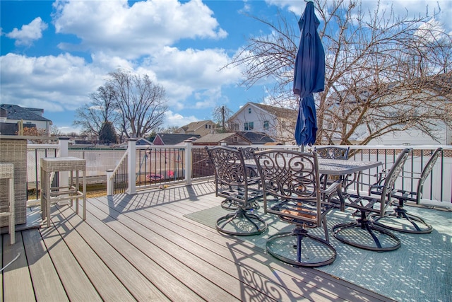 wooden deck with outdoor dining space