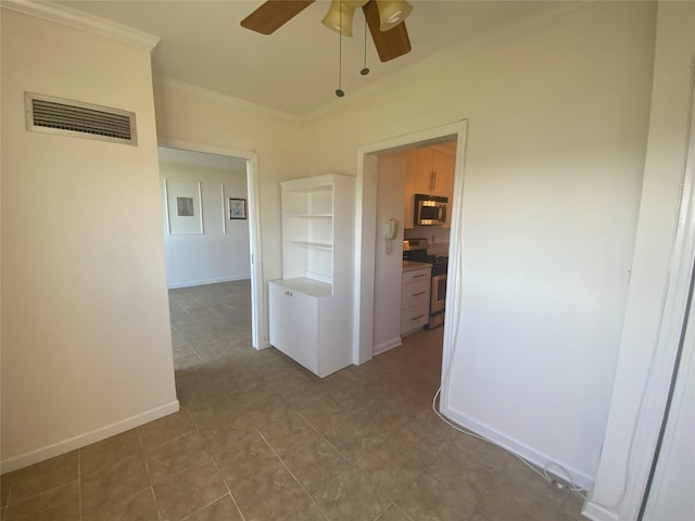 hallway with visible vents, baseboards, and crown molding