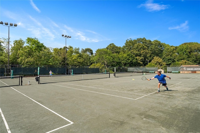view of sport court with fence