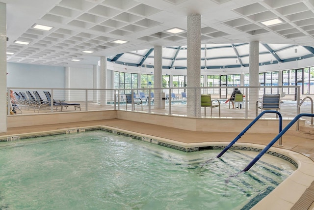 view of swimming pool with an indoor in ground hot tub