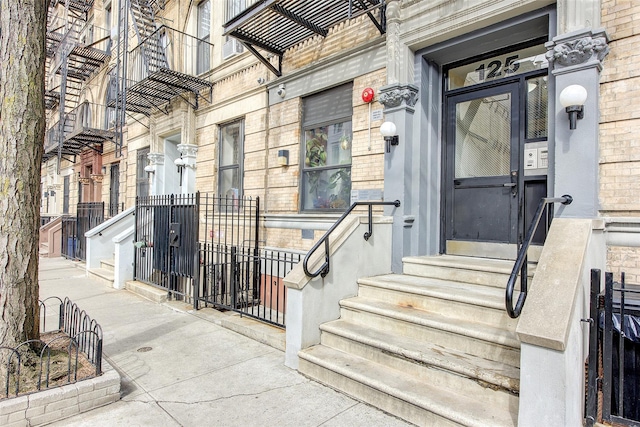 property entrance with brick siding