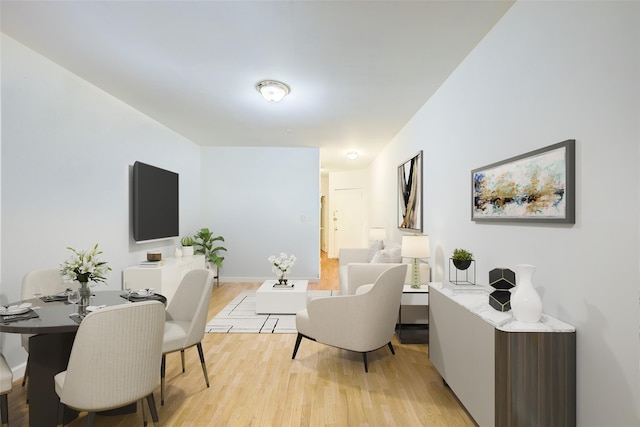 living room featuring light wood-style floors and baseboards