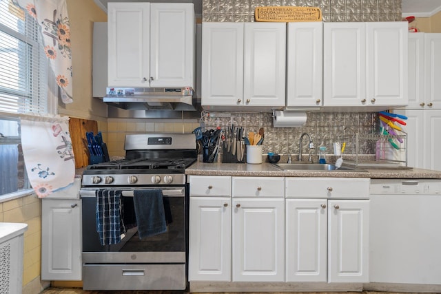 kitchen with gas stove, white cabinetry, under cabinet range hood, dishwasher, and a sink