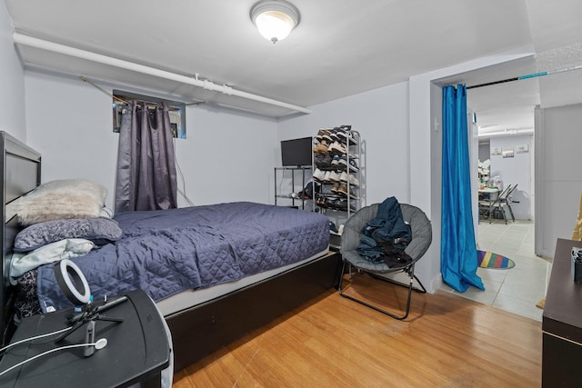 bedroom with wood finished floors