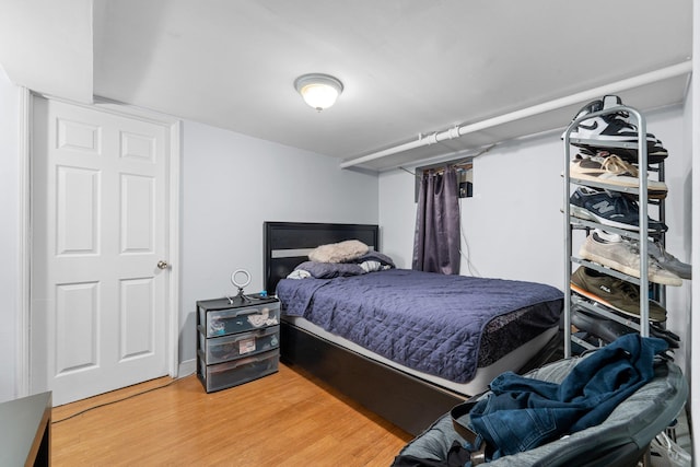 bedroom featuring light wood-style flooring