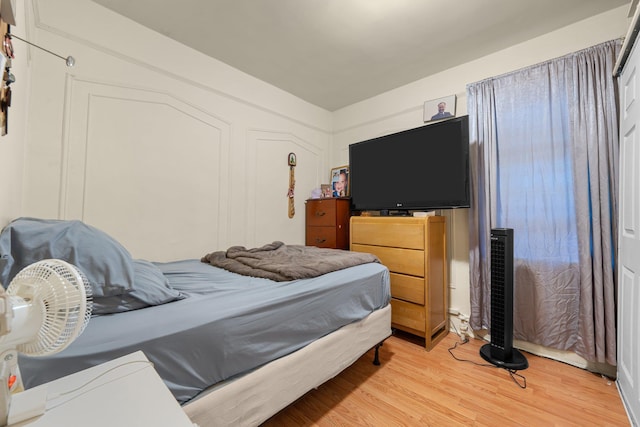 bedroom featuring light wood-style floors