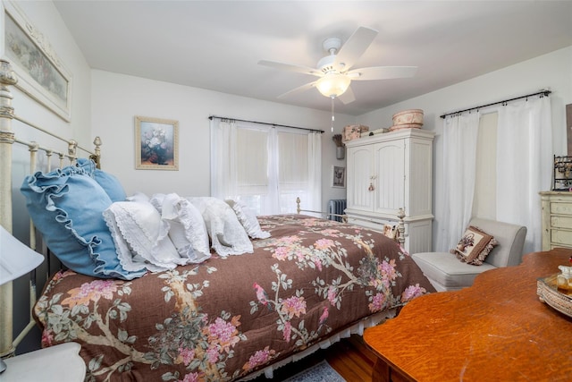 bedroom featuring ceiling fan and wood finished floors