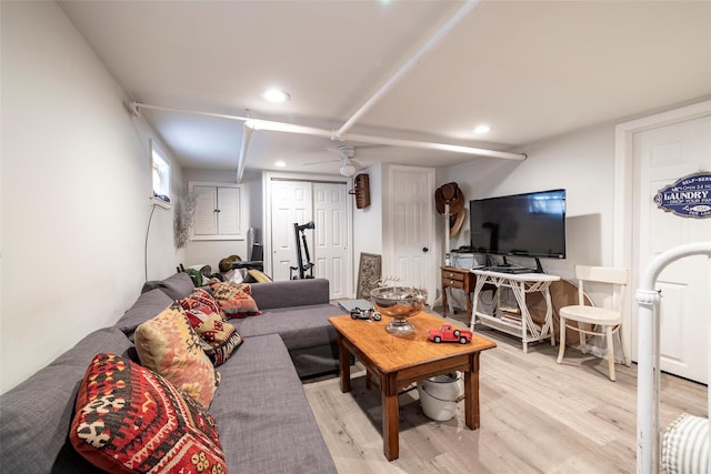 living area with recessed lighting and light wood-style flooring