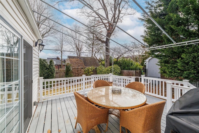 wooden terrace featuring grilling area