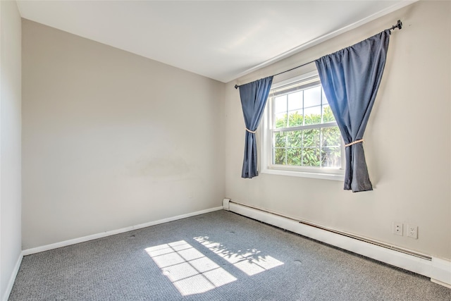 carpeted empty room with a baseboard heating unit and baseboards