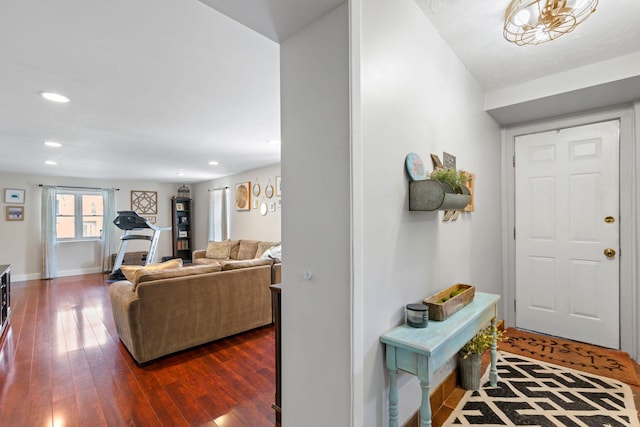 foyer entrance with recessed lighting, baseboards, and dark wood-style flooring