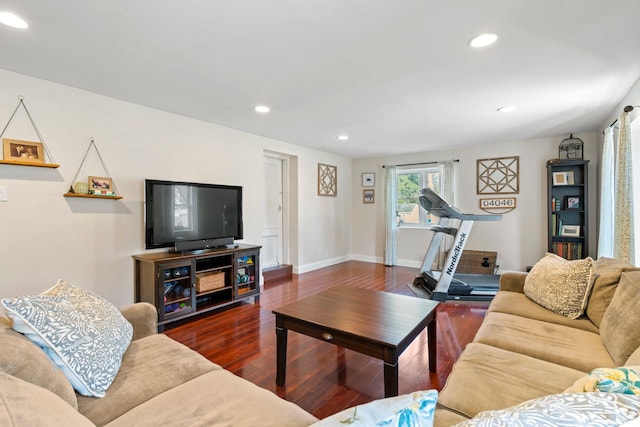 living area with recessed lighting, wood finished floors, and baseboards