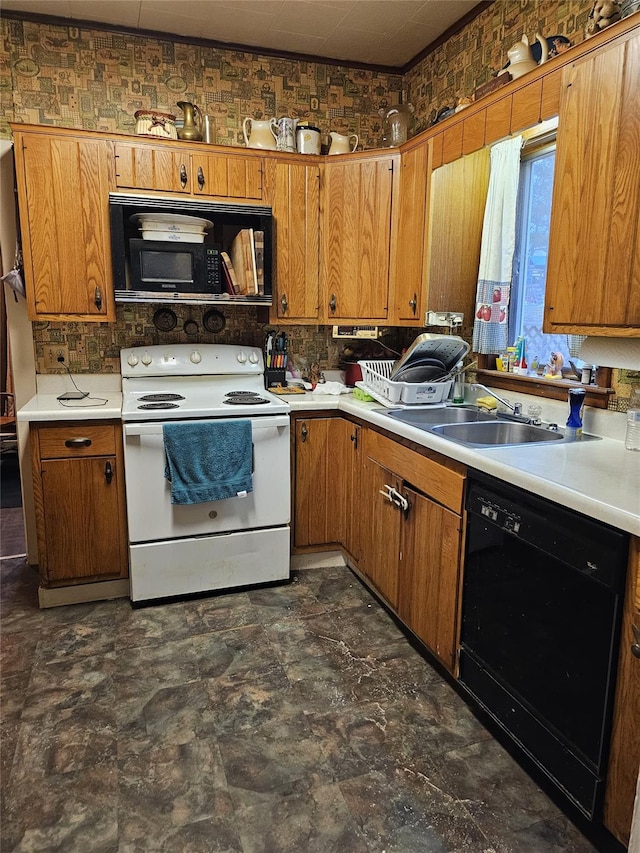 kitchen featuring brown cabinets, black appliances, light countertops, and a sink