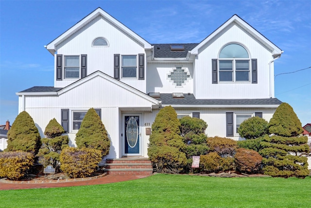 view of front of home with a front lawn