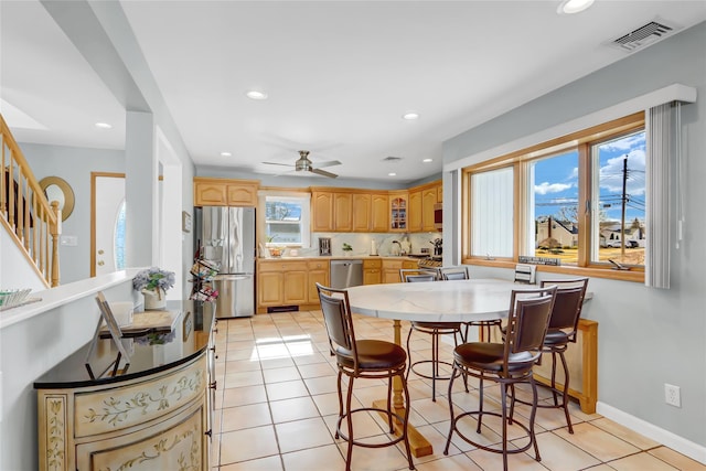 dining room with light tile patterned floors, visible vents, recessed lighting, and a ceiling fan