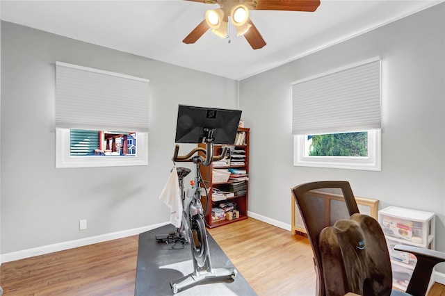 home office with wood finished floors, baseboards, and ceiling fan