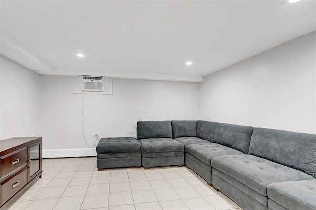 living room with light tile patterned flooring, recessed lighting, a wall mounted AC, and baseboards