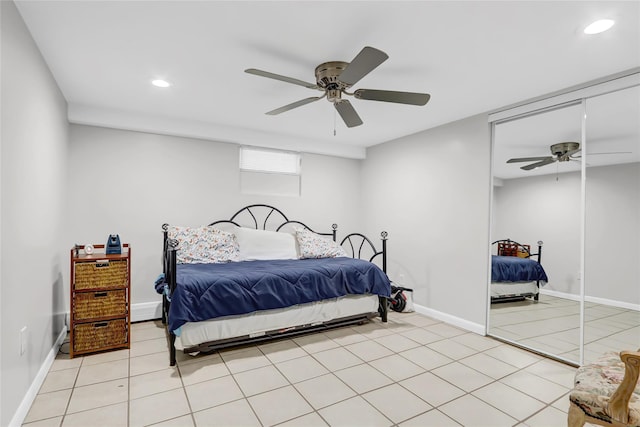 bedroom with light tile patterned floors, recessed lighting, baseboards, and a ceiling fan