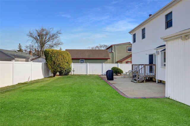 view of yard featuring a patio and a fenced backyard