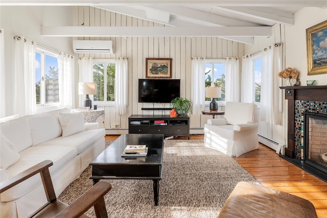 living room featuring a wall unit AC, hardwood / wood-style flooring, lofted ceiling with beams, and baseboard heating