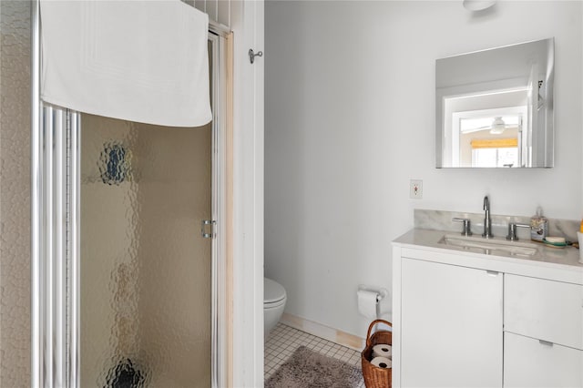 full bathroom featuring tile patterned floors, a stall shower, toilet, and vanity