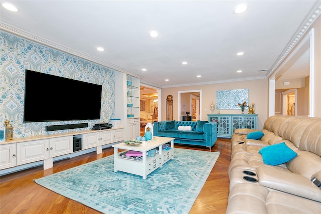 living area featuring wood finished floors, recessed lighting, wallpapered walls, and ornamental molding