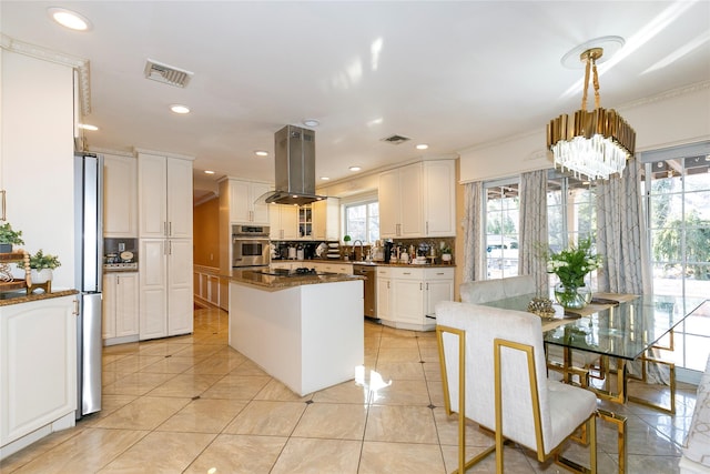 kitchen with tasteful backsplash, a center island, white cabinetry, stainless steel appliances, and island range hood