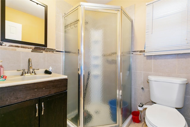 full bath featuring a stall shower and tile walls