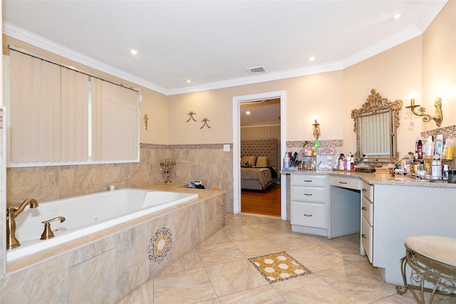 bathroom featuring vanity, crown molding, a garden tub, and visible vents