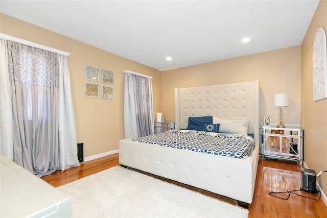 bedroom featuring recessed lighting, baseboards, and wood finished floors