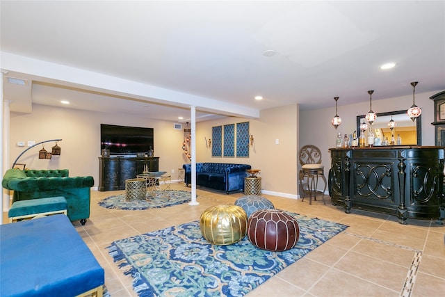 living area with a bar, tile patterned floors, recessed lighting, and visible vents