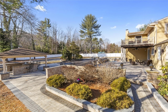 view of yard with a ceiling fan, a patio area, a gazebo, and fence