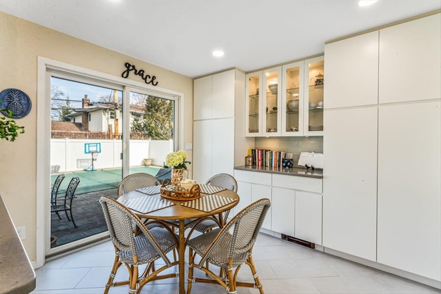 dining room featuring light tile patterned flooring and recessed lighting