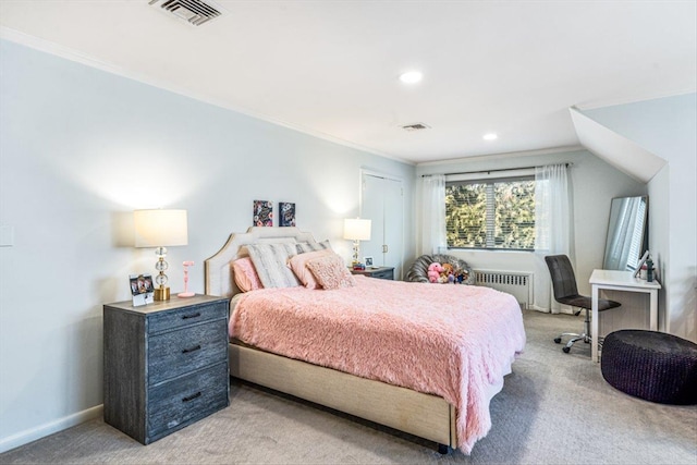 bedroom with light carpet, visible vents, radiator heating unit, and baseboards