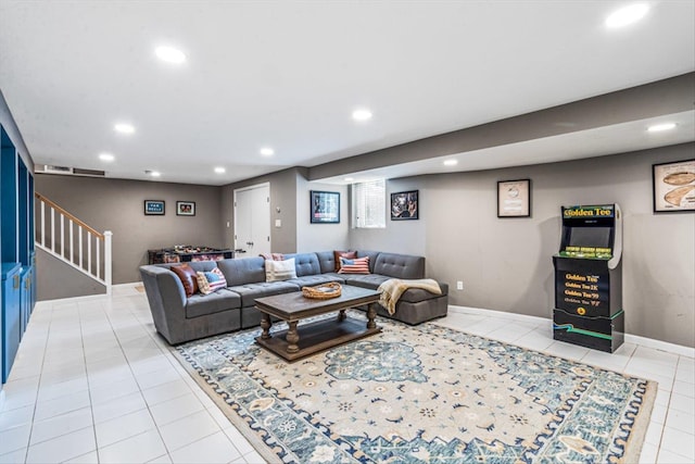 living area featuring stairway, light tile patterned floors, recessed lighting, and baseboards