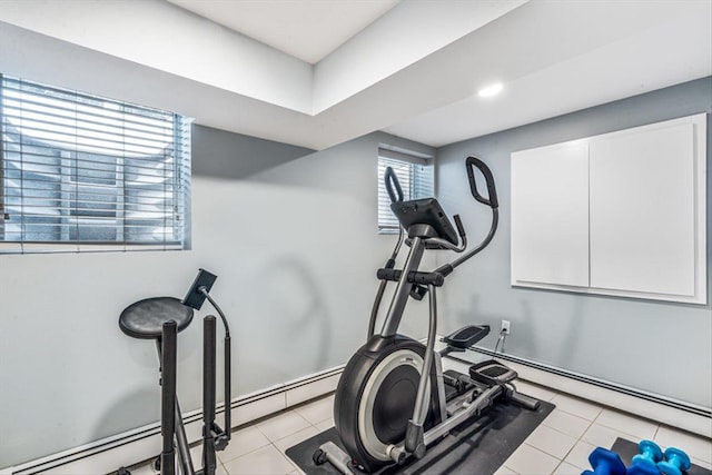 workout area featuring light tile patterned flooring