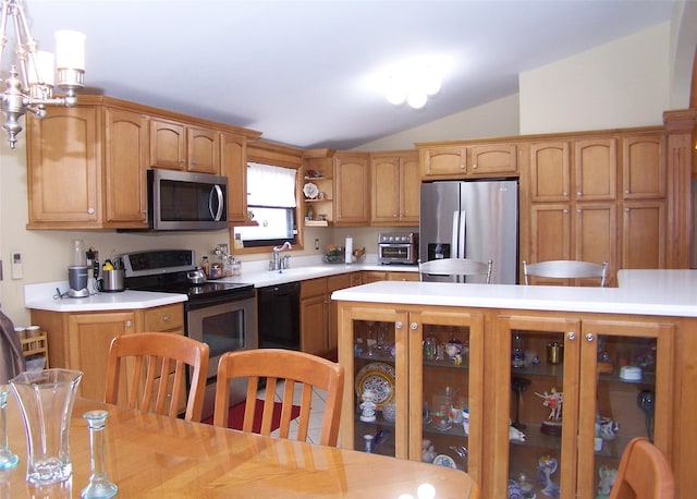 kitchen with open shelves, light countertops, vaulted ceiling, appliances with stainless steel finishes, and a sink