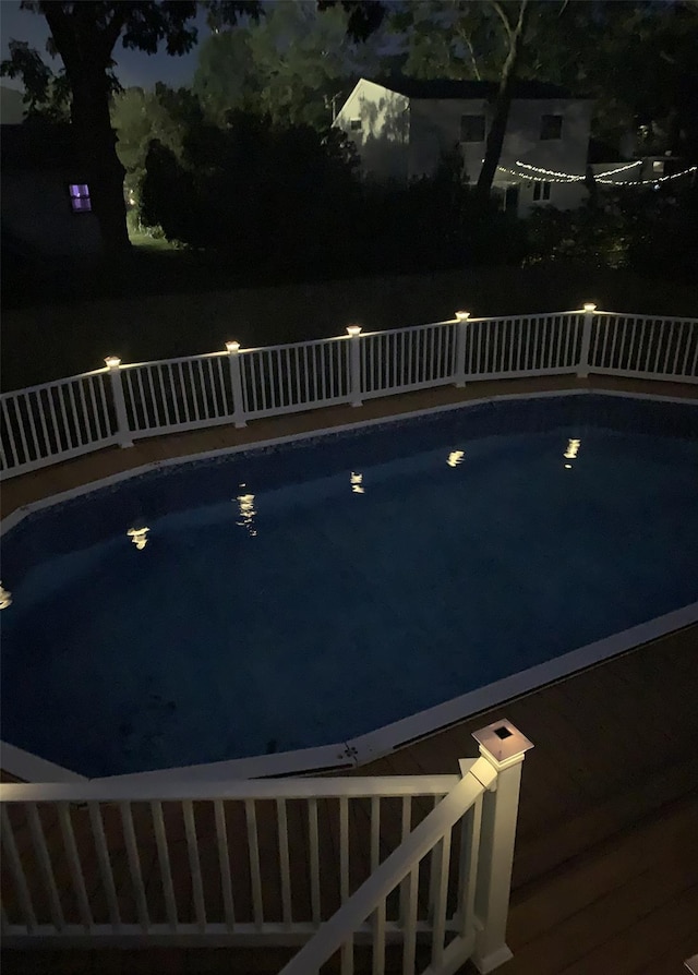 pool at twilight with an outdoor pool