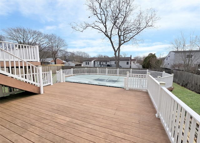 deck featuring a residential view and fence