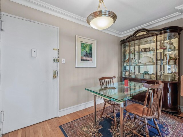 10740 Queens Blvd Pha, Pha, Forest Hills, NY 11375 - dining space featuring hardwood / wood-style flooring, ornamental molding, and baseboards