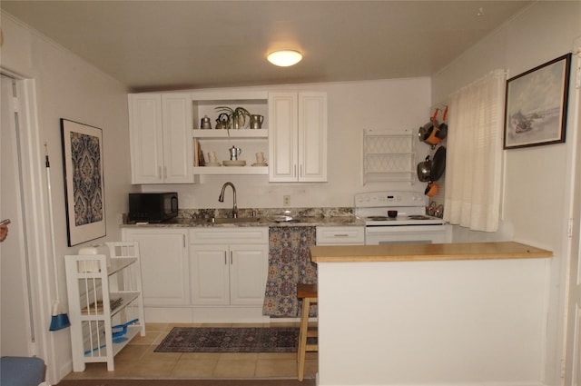 kitchen with open shelves, black microwave, electric stove, white cabinets, and a sink