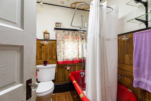 bathroom featuring toilet and wood finished floors