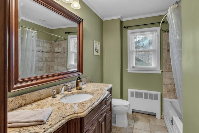 bathroom with vanity, radiator heating unit, plenty of natural light, and ornamental molding